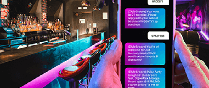 Sample text message over a bar/lounge setting background